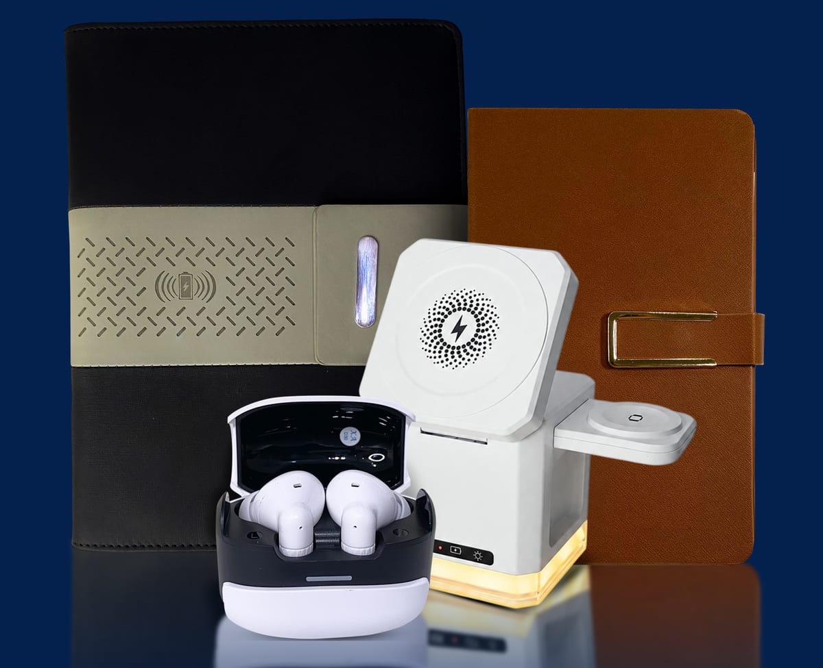 Rangkaian souvenir kantor premium Melia Optimus: notebook dengan wireless charging, folio kulit, TWS earbuds, dan wireless charger 3-in-1